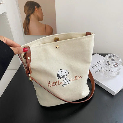 2026 New Women's Snoopy Canvas Bucket Bag Embroidered "Little Cute" Cartoon Shoulder Bag Leather Strap Casual Daily Handbag
