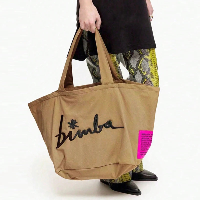 Fashionable and simple large capacity popular solid color handbag, personalized and multifunctional casual letter embroidered sh
