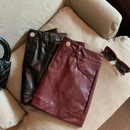 Wine red PU leather skirt half skirt for women, 2024 autumn and winter anti glare A-line hip hugging short skirt