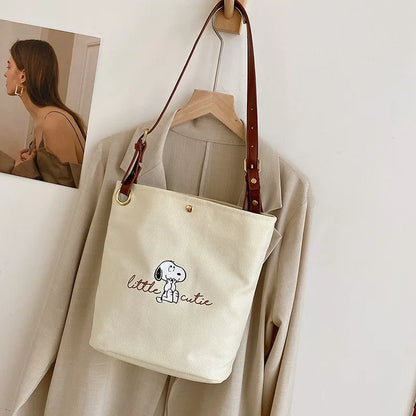 2026 New Women's Snoopy Canvas Bucket Bag Embroidered "Little Cute" Cartoon Shoulder Bag Leather Strap Casual Daily Handbag