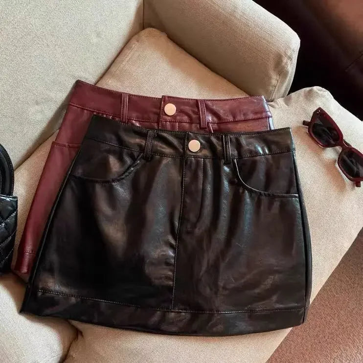 Wine red PU leather skirt half skirt for women, 2024 autumn and winter anti glare A-line hip hugging short skirt