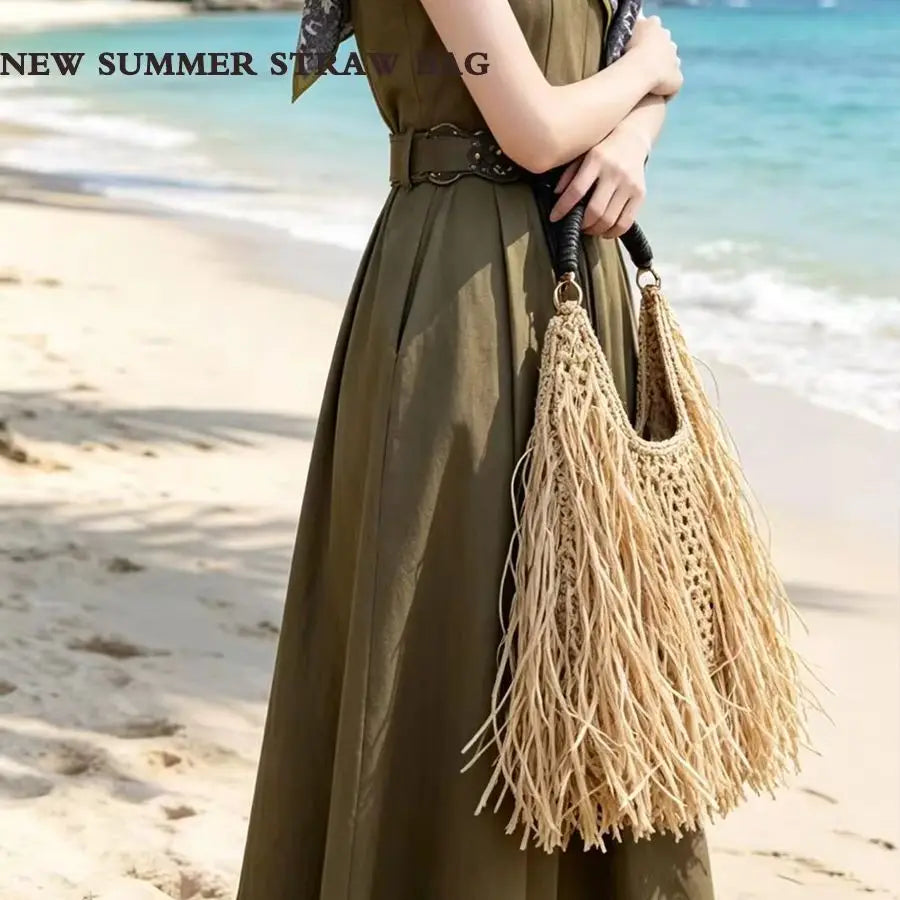 Pure hand-woven women's bags niche design ethnic holiday style straw woven fringed portable shoulder women's bags