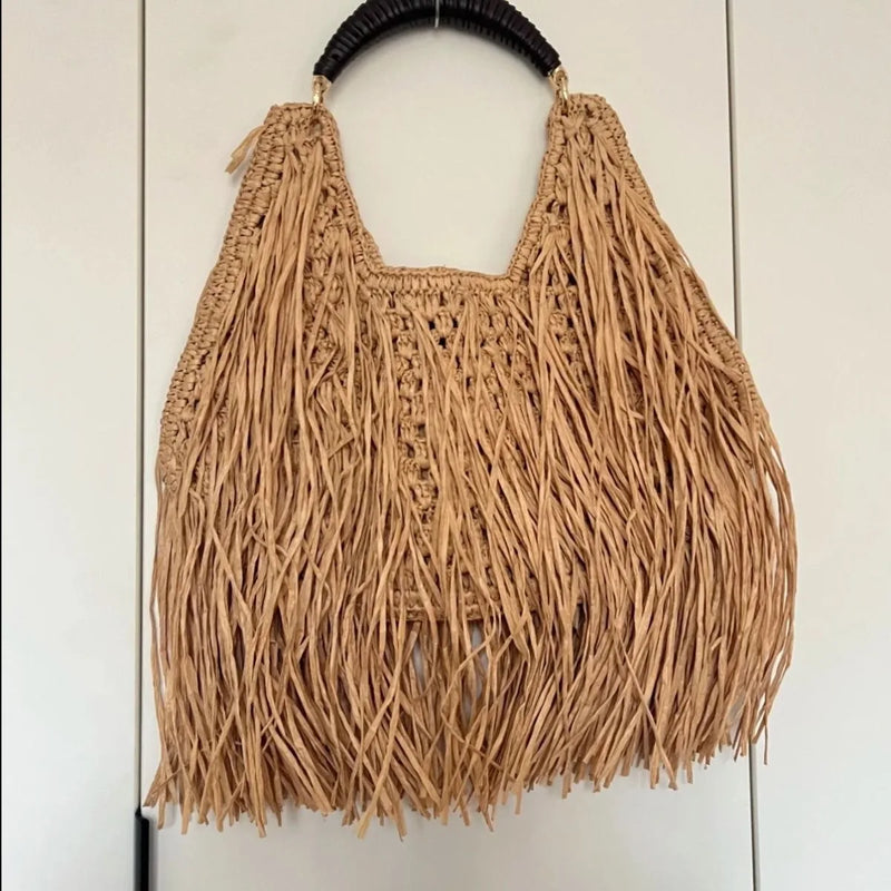Pure hand-woven women's bags niche design ethnic holiday style straw woven fringed portable shoulder women's bags