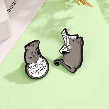 Smart and mischievous little mouse reading newspaper, climbing ladder to find food, cartoon cute animal brooch