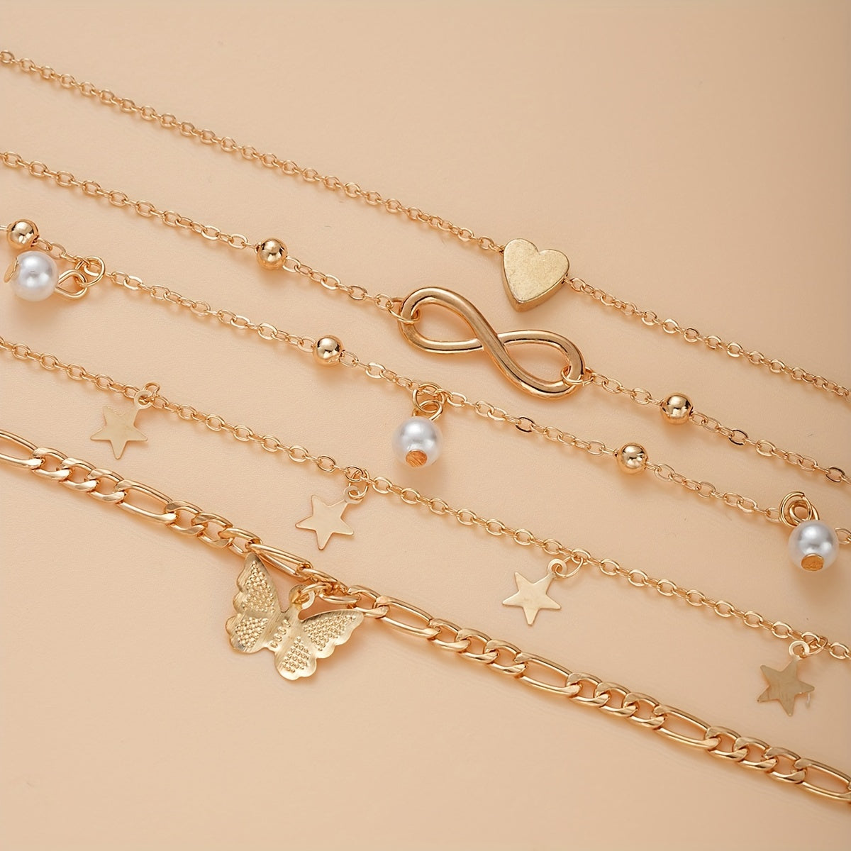 Bohemian Chic 4-Piece Anklets Set, Golden With Heart, Butterfly, Infinity & Star Charms, Faux Pearl Accents, Metal Anklets For Beach Party